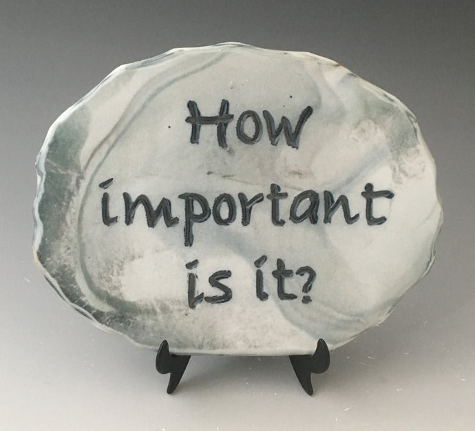 How important is it? - inspirational plaque on stand